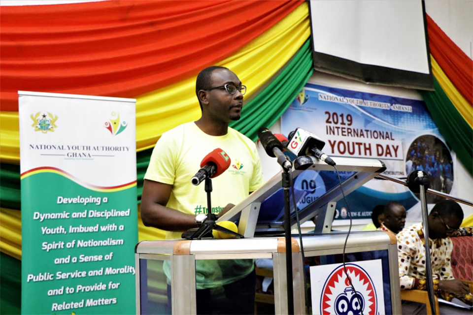 A picture of the Ashanti Regional Director of NYA, George Orwell Amponsah addressing the youth