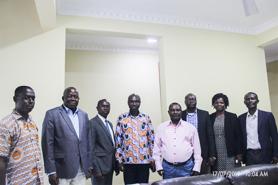 Mr. Francis Obeng (3rd from left) in a pose with Vice-Chancellor, Registrar and officials from Human Resource, Finance and Legal Office