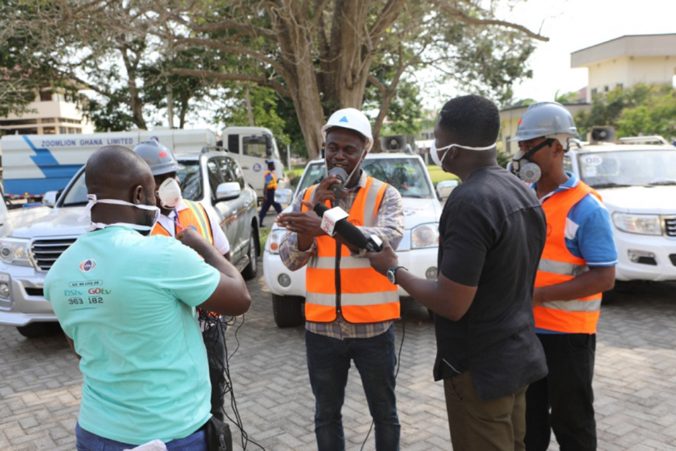 Leader of the disinfection team, Mr. Gideon Sogbey (middle) telling the purpose for the exercise