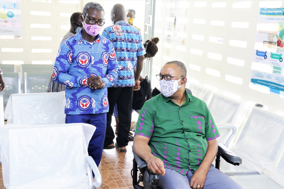 Board Member of the UEWCCU presenting the chairs