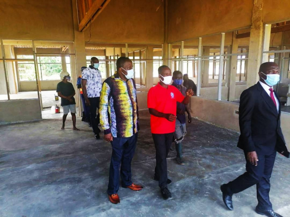 Rev. Fr. Prof. Anthony Afful-Broni (left) and Mr. Francis Obeng (far right) being escorted around the new facility by Assistant Farm Manager, Mr. Mark Affusah (middle), during the inspection.