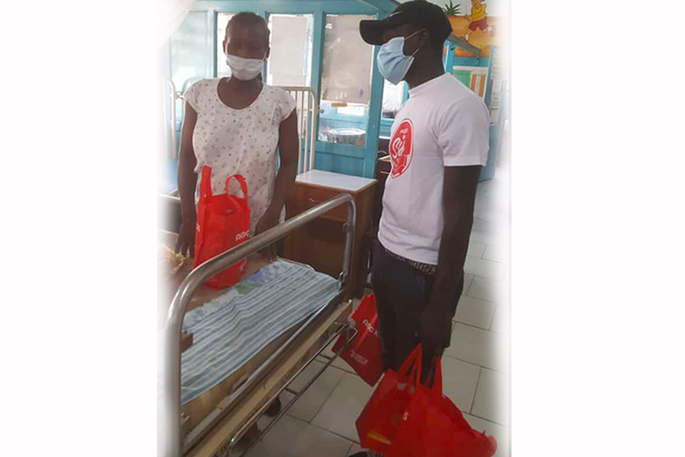 A member of feed the sick with a patient 