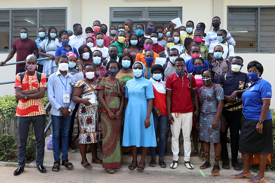 Peer Educators in a group picture with the facilitator at Ajumako Campus
