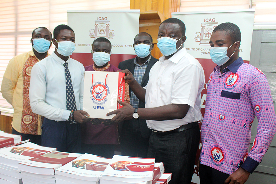 Prof. Braimah Awaisu Imurana (second from right) receiving the items on behalf of Management
