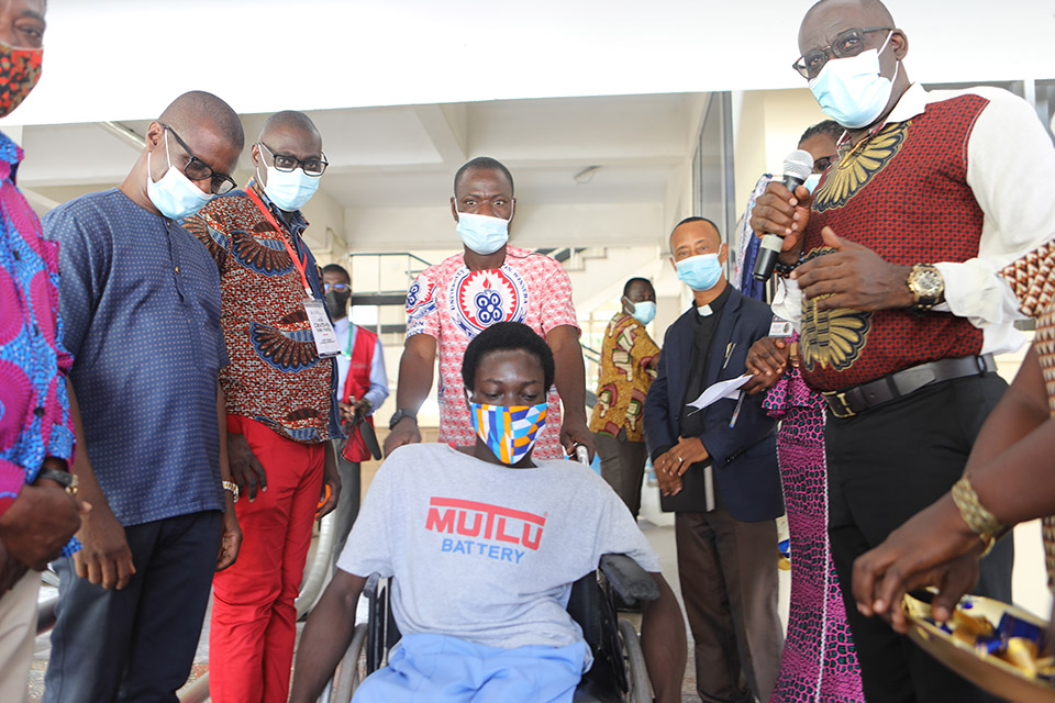 A special needs student being ushered down the newly commissioned walkway