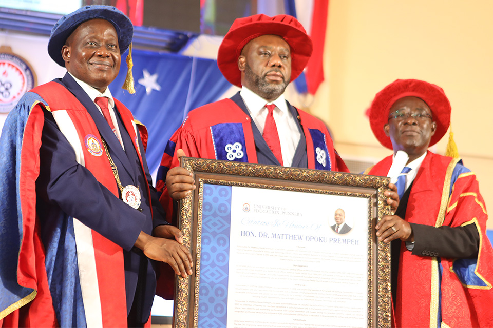 Hon. Dr. Opoku Prempeh (middle) receiving a citation in his honor