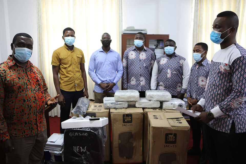 Dean, Prof. George Kankam (left) receiving the items on behalf of the School of Graduate Studies, UEW