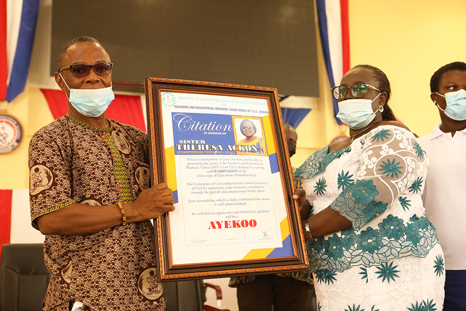 Sis. Theresa Ackon being presented with a citation for her meritorious service to TEWU and UEW