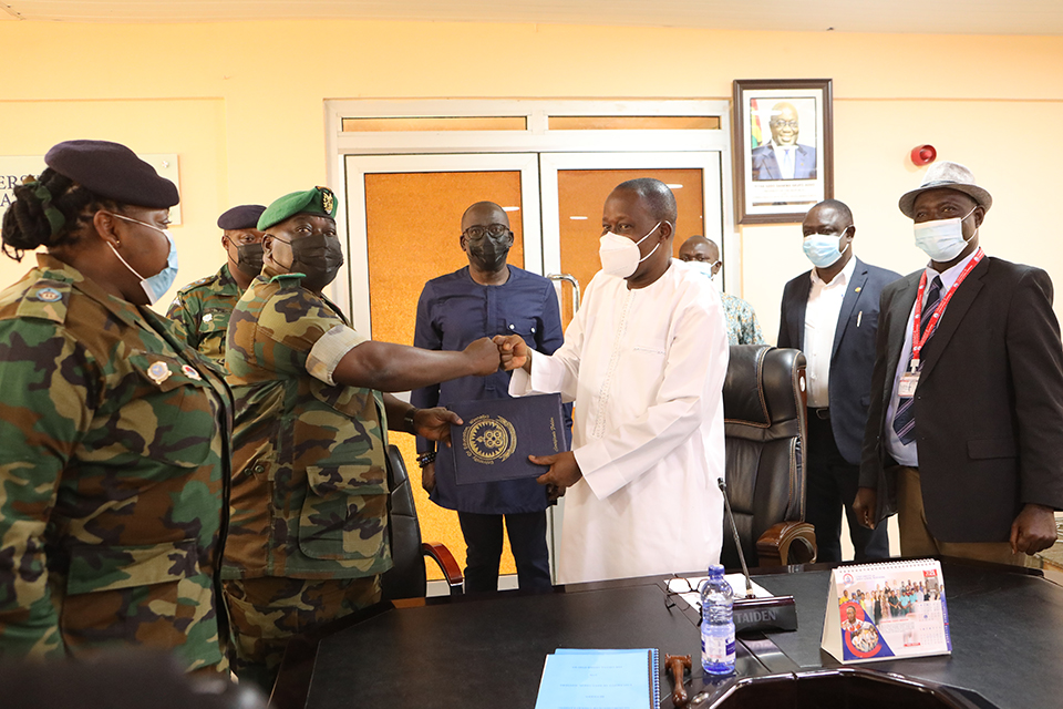 Brigadier General Ampofo-Gyekye with the Vice-Chancellor after the signing ceremony