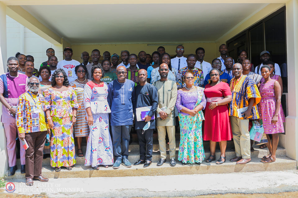Attendees in a group pose after the event