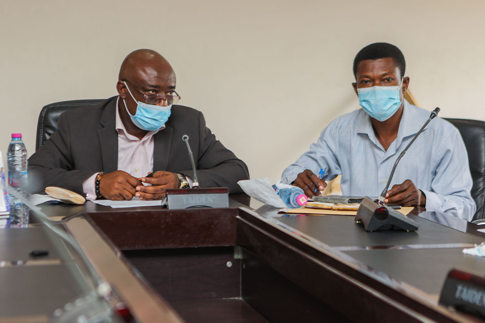 Prof. Charles K. Assuah being assisted by Mr. Seth A. Tompoli to take the team through the schedule for the International Fellows week