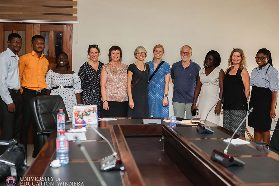 UEW staff and the UCN delegation in a group pose after the interaction