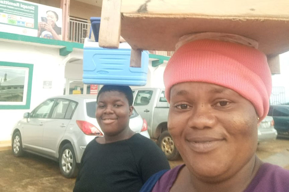 Ms. Priscilla Akwagu doing business with her first daughter  