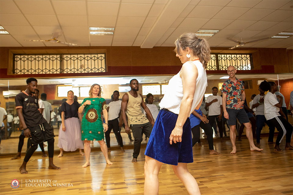 The foreign lecturers and UEW students practising a Danish dance called "six rounds"