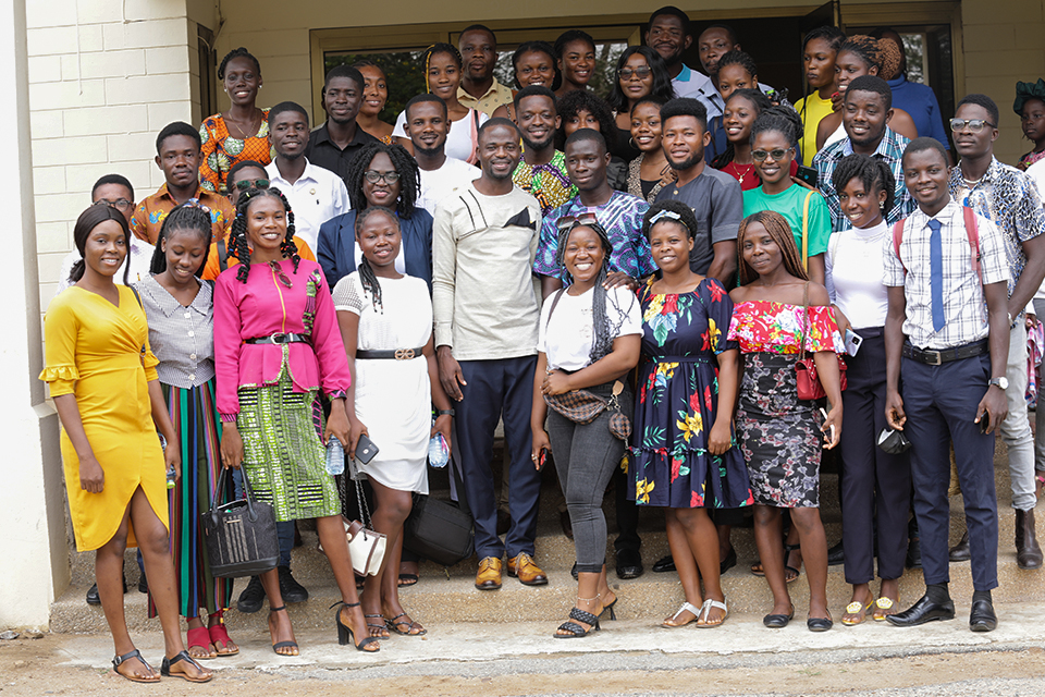The resource person in a group picture with Journalism and Media Studies students
