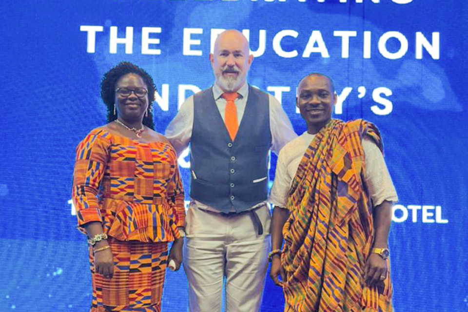 Mr. Ebenezer Otoo (right) in a pose with the Effutu Municipal Director of Education, Mrs. Mabel Judith Micah (left), and a member of the organising committee