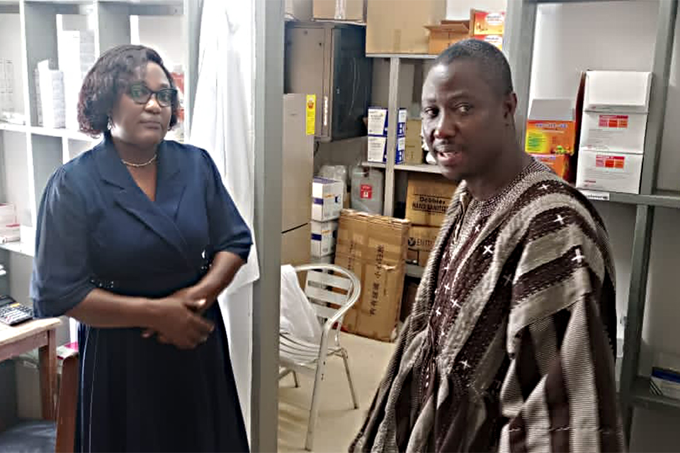 Dr. Beth Offei-Awuku (left) conducting the Ag. Director of Health Services, Dr. Yambah, to inspect the Ajumako Health facility