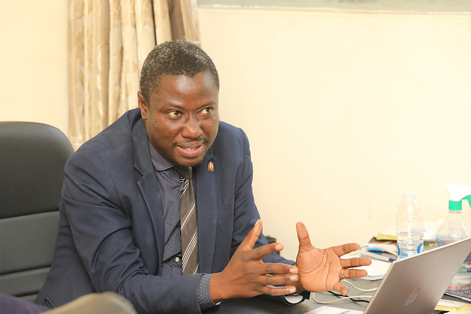 Dr. John Yambah explaining the development to the staff from the Media Relations Unit