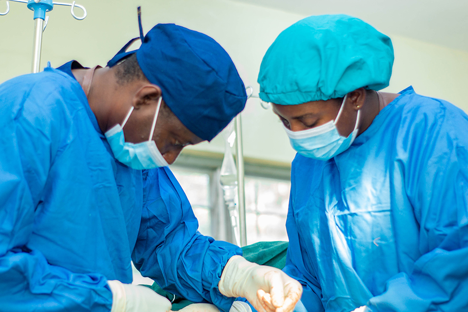 Dr. Yambah (left) and a colleague practitioner undertaking the operation