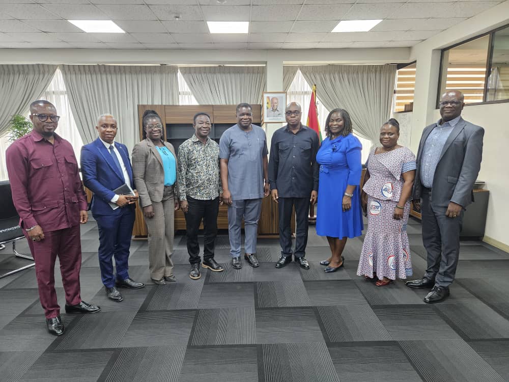 A group photo featuring UEW management staff