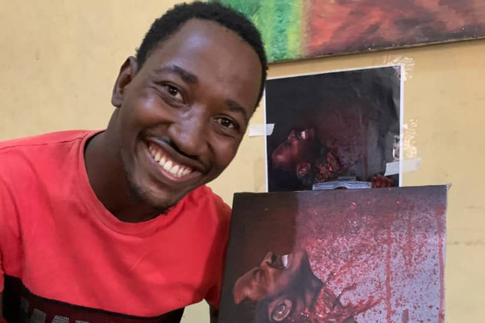 Mr. Samuel Kwasi Akonnor showcasing his artwork 