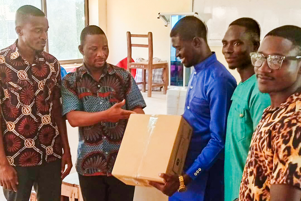 Prof. Samuel Alhassan Issah receiving the equipment on behalf of the College