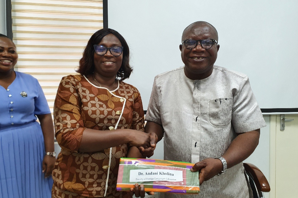 Prof. Eshun receiving a token of appreciation on behalf of Dr. Andani Kholina, FQAO for Faculty of Foreign Languages Education