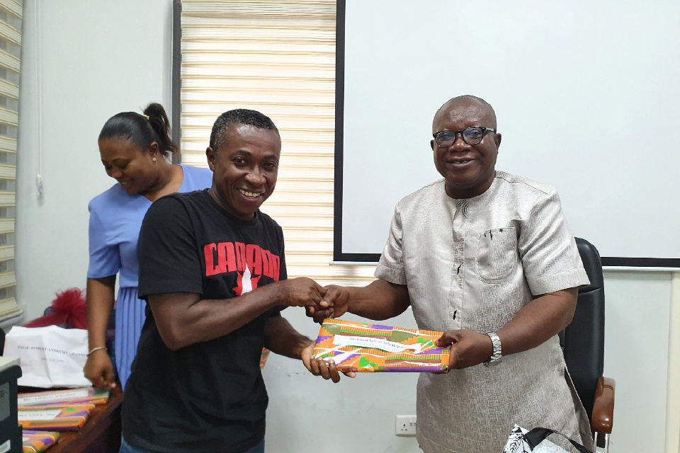 Prof. Ghanney presenting a token of appreciation to Dr. Ernest Yeboah, FQAO for Faculty of Health, Allied Sciences and Home-Economics Education.