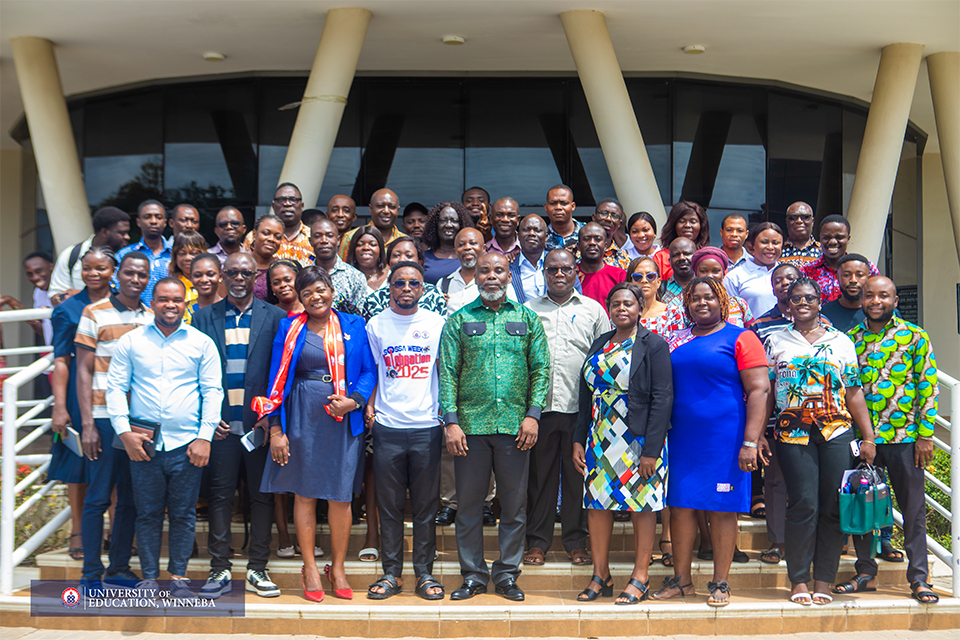 Faculty members and postgraduate students in a group photograph taken after the retreat