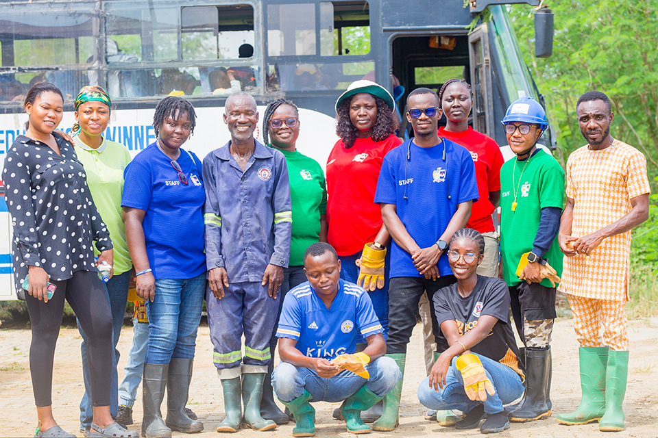 UEW Basic School teachers pose in a picture with the farm manager and his assistant