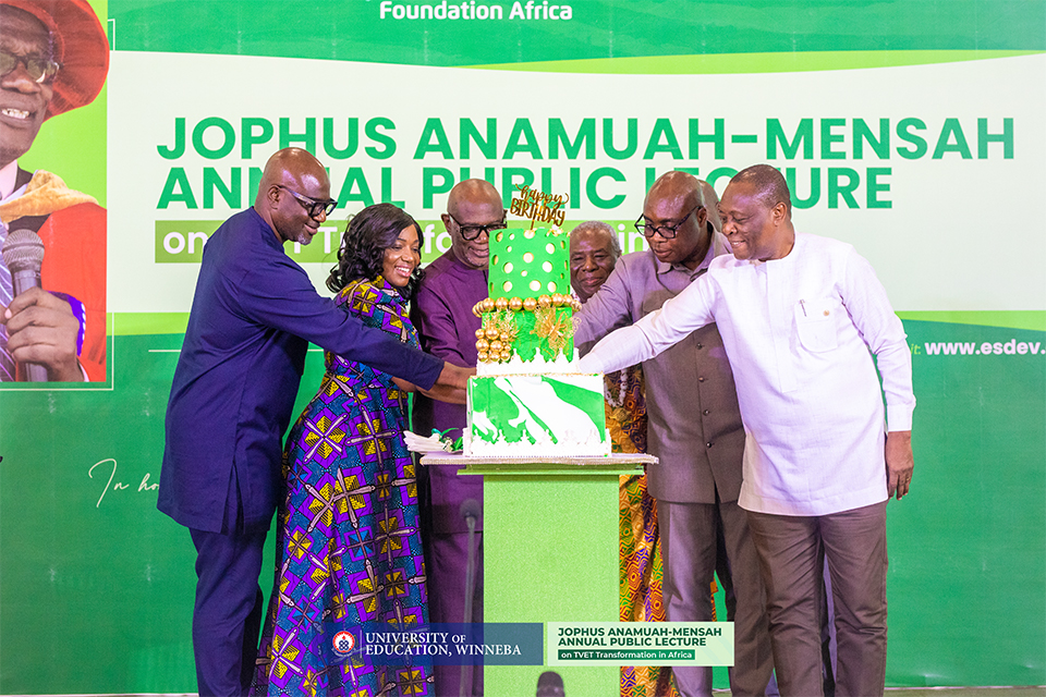 Prof. Anamuah-Mensah, together with his family and guests, cutting a cake to mark his 79th birthday