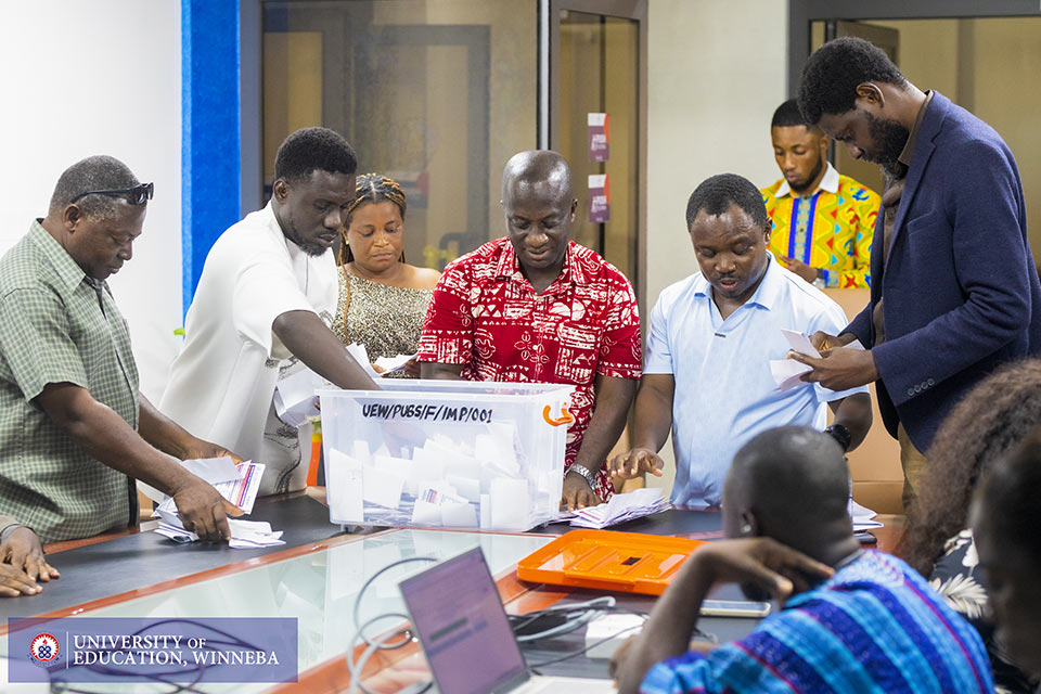 Staff from the Division of Publications and Communication collating ballots after voting