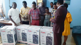 A group picture with the items been donated by the UEW PhD Student
